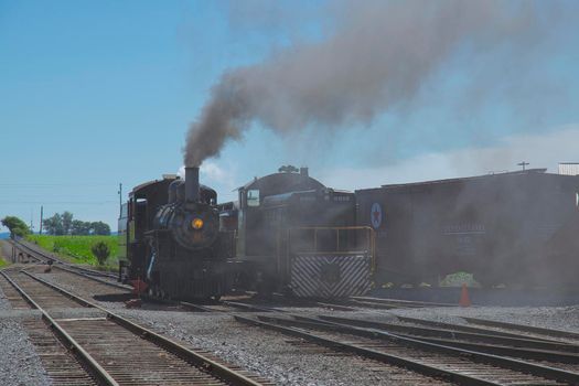 Strasburg, Pennsylvania, July 2018 - A 1906 Steam Locomotive and a Diesel Locomotive Seating Side by Side