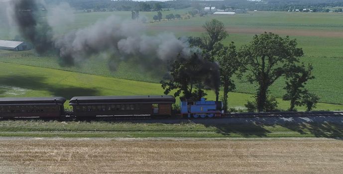 Ronks, Pennsylvania, June 2019 - Aerial View of Thomas the Tank Engine Puffing and Steaming along the Countryside