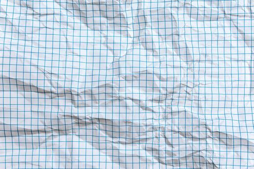 Background, texture of a crumpled notebook sheet with grid-like markings