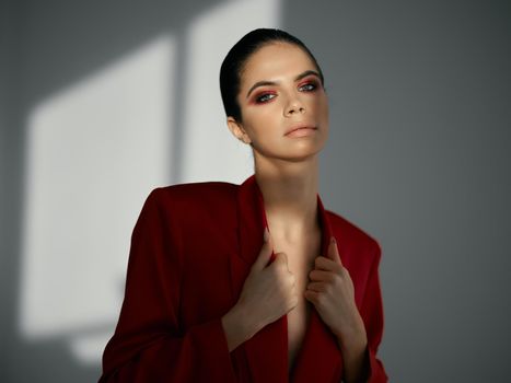 pretty woman red jacket cosmetics luxury decoration studio. High quality photo