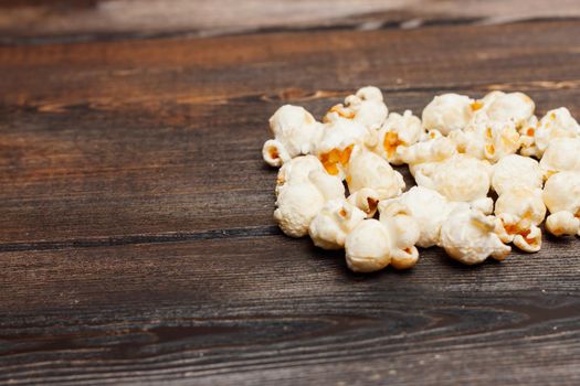 popcorn on a wooden table snack classic delicacy. High quality photo