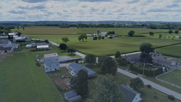 Aerial View of Green Farmlands With Different Crops Growing in the Fields on a Sunny Day