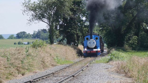 Ronks, Pennsylvania, June 2019 - Aerial View of Thomas the Tank Engine Puffing and Steaming along the Countryside