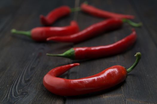 red chili seasoning kitchen wooden background spice. High quality photo