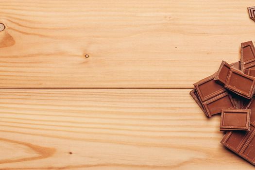 cake and chocolate bar wooden background image texture. High quality photo