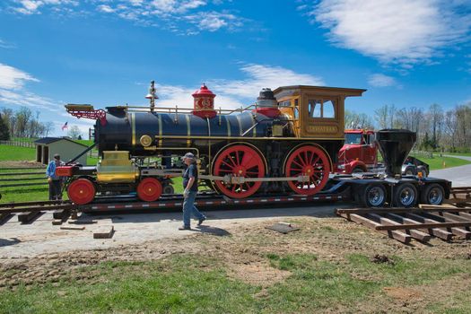 Elizabethtown, Pennsylvania, December 2018 - View of a Replica 1860's Steam Locomotive Being Placed on a Rail Road Track and Assembled