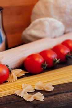 ingredients for italian cuisine pasta cherry tomatoes cooking. High quality photo