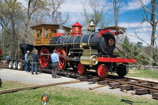 Elizabethtown, Pennsylvania, December 2018 - View of a Replica1860's Steam Locomotive Being Placed on a Rail Road Track and Assembled