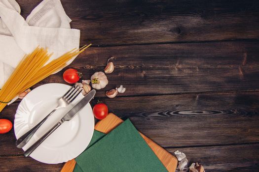 pasta plate with spoon and fork italian cuisine garlic. High quality photo