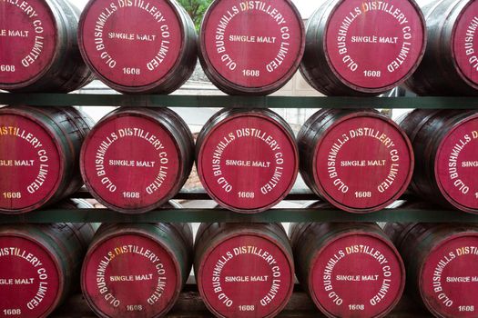 Bushmills, Northern Ireland - June 208, 2017: Barrels with single malt whiskey in Old Bushmills Distillery. The distillery is a popular tourist attraction, with around 120,000 visitors per year.