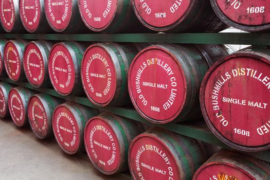 Bushmills, Northern Ireland - June 208, 2017: Barrels with single malt whiskey in Old Bushmills Distillery. The distillery is a popular tourist attraction, with around 120,000 visitors per year.