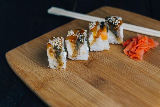 red ginger sushi chopsticks wooden board meal gourmet. High quality photo