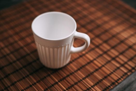 white mug on the table indoors stand texture top view. High quality photo