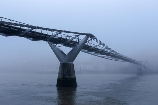 London's Millennium Bridge on a foggy morning