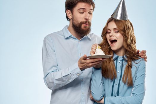Birthday cake with candle man and woman corporate party fun holidays. High quality photo