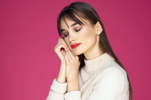Woman with red lips bright makeup white blouse long hair pink background. High quality photo