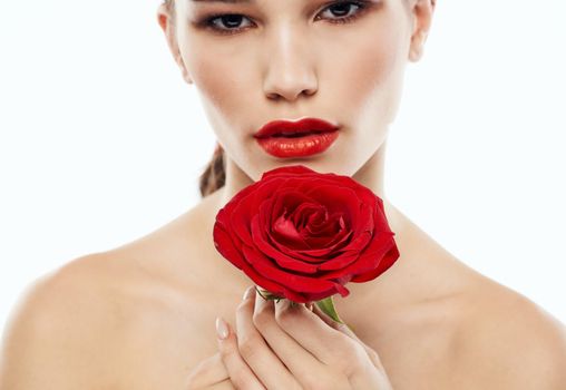 Portrait of a woman with red flower eye shadow on the eyelids eyebrow makeup red lips. High quality photo