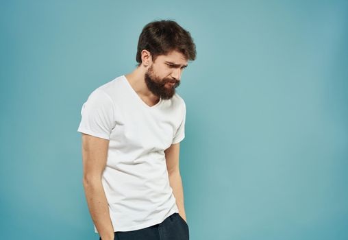 upset man on blue background cropped view Copy Space Model. High quality photo