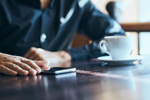 Man in a cafe and notebooks official work communication. High quality photo