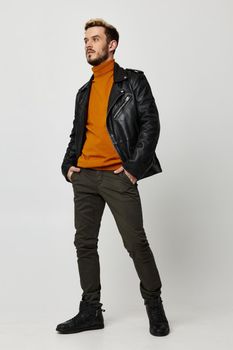 season trend orange sweater leather jacket pants shoes model. High quality photo