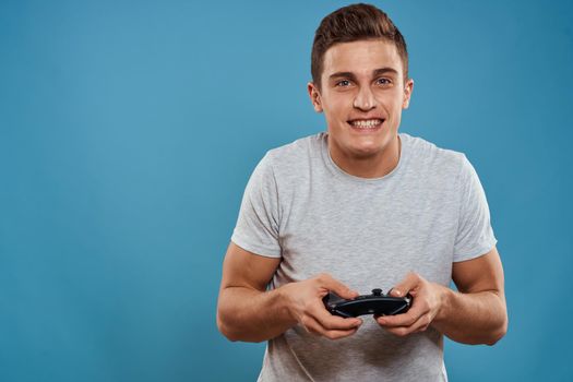 male gambler technology joystick entertainment virtual reality blue background. High quality photo