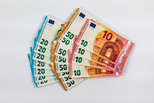 50 20 10 euro banknotes fan out on white background