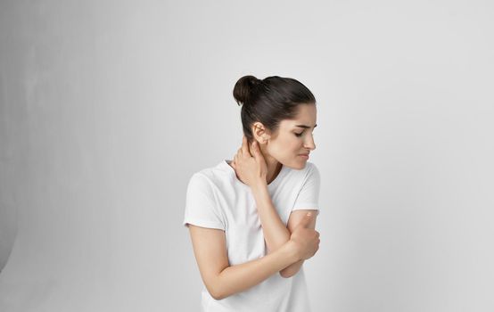 woman in white t-shirt health problems body pain discomfort. High quality photo