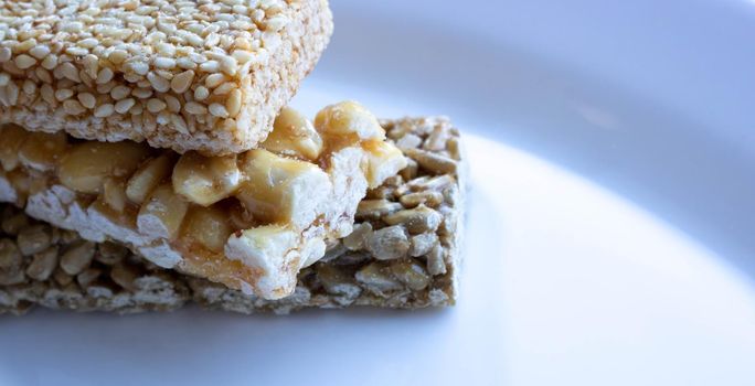 Delicious Honey kozinaki on a white plate.