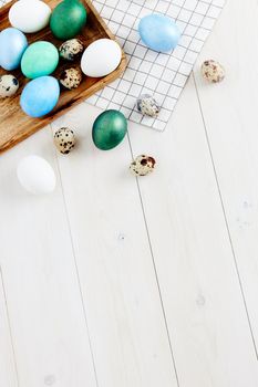 colorful eggs on wooden background and Easter holiday tradition church. High quality photo