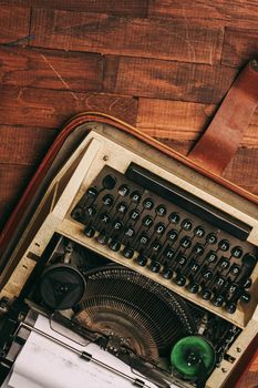 typewriter retro style nostalgia journalist technology technology wood background. High quality photo