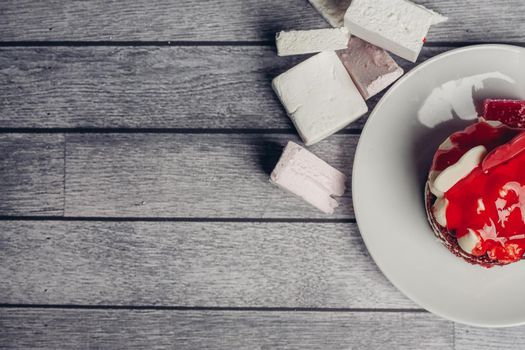 red round cake sweets meal dessert with tea wooden background. High quality photo