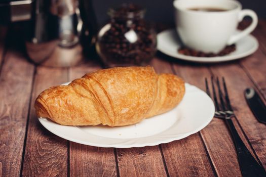 fresh croissants on the table breakfast for dessert close-up. High quality photo