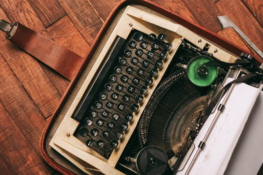 typewriter retro typewriter classic style mechanical technology wood background. High quality photo