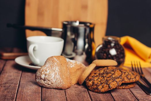 sweet pastries and desserts tea party wooden table breakfast snack. High quality photo