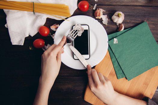 mobile phone plate cooking ingredients kitchen technology. High quality photo
