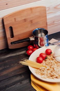 ingredients for cooking lunch italian cuisine pasta cherry tomatoes. High quality photo