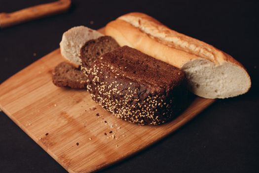 flour products on a wooden board baking loaf of bread. High quality photo