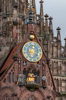 Close up of the clock and other details from the Frauenkirche (woman church) in Nuremberg, Bavaria, Germany