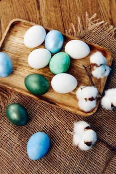 colorful easter eggs wooden background top view decoration. High quality photo