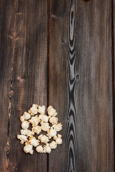 popcorn on a wooden table enjoyment rest meal snack. High quality photo