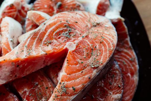 red fish marinated on a plate wooden background. High quality photo