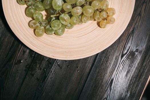 multicolored grapes on a plate vitamins fruit freshness organic. High quality photo