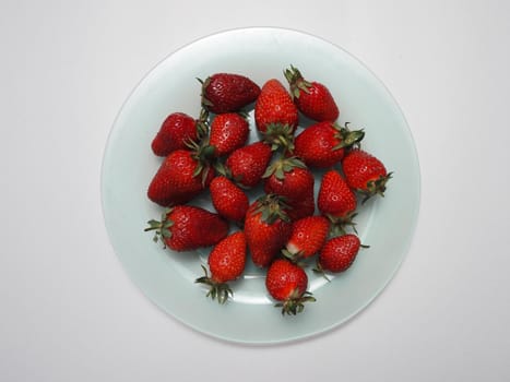 Ripe strawberries. Ripe red berries on a platter. High quality photo