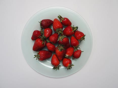 Ripe strawberries. Ripe red berries on a platter. High quality photo