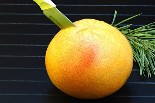 Ripe juicy grapefruit in isolation on a black background. A large image. High quality photo