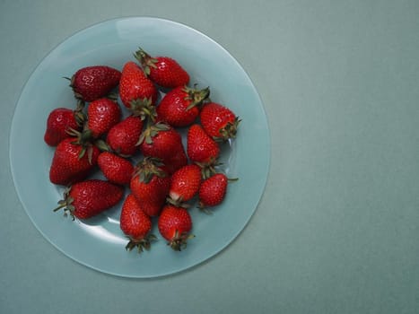 Ripe strawberries. Ripe red berries on a platter. High quality photo
