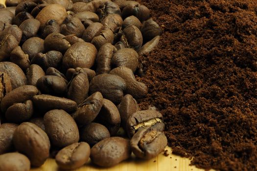 The background of coffee beans and ground coffee. Macro. Brown background. High quality photo