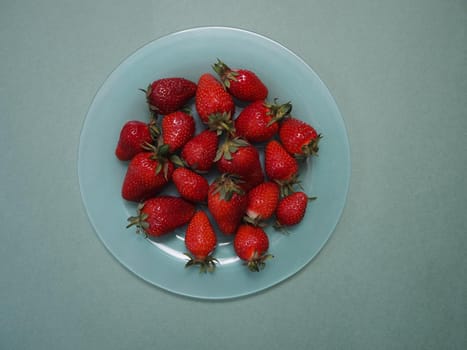 Ripe strawberries. Ripe red berries on a platter. High quality photo