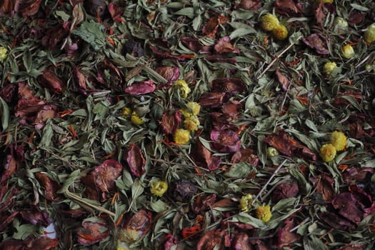 A beautiful background of dried herbs and flowers. Dark tones.