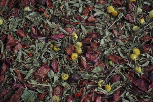 A beautiful background of dried herbs and flowers. Dark tones.